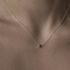 Solid gold and sterling silver jewellery: Video of a model wearing our signature 9ct yellow gold tiny letter D charm necklace on a 40cm cable chain