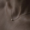 Solid gold and sterling silver jewellery: Video of a model wearing our signature tiny letter B charm necklace on a 40cm cable chain