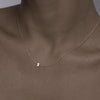 Solid gold and sterling silver jewellery: Close up video of a model wearing our signature 9ct yellow gold Tiny Letter Z Charm Necklace on a 40cm cable chain