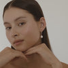 Beautiful video of our hand-wrapped solid gold small baroque pearl earrings in 9ct yellow gold on 15mm everyday sleepers.