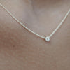 Solid gold and sterling silver jewellery: Video of a model wearing our signature sterling silver tiny letter G charm necklace on a 40cm cable chain