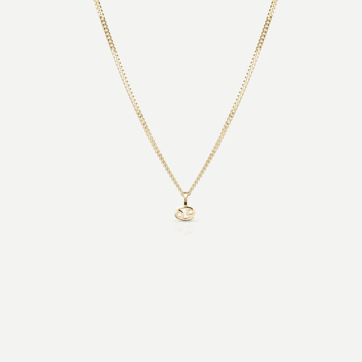 Solid gold and silver jewellery: A single Kate & Kole hand finished zodiac necklace in 9ct yellow gold