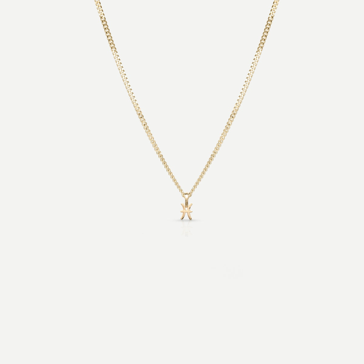 Solid gold and silver jewellery: A single Kate & Kole hand finished zodiac necklace in 9ct yellow gold